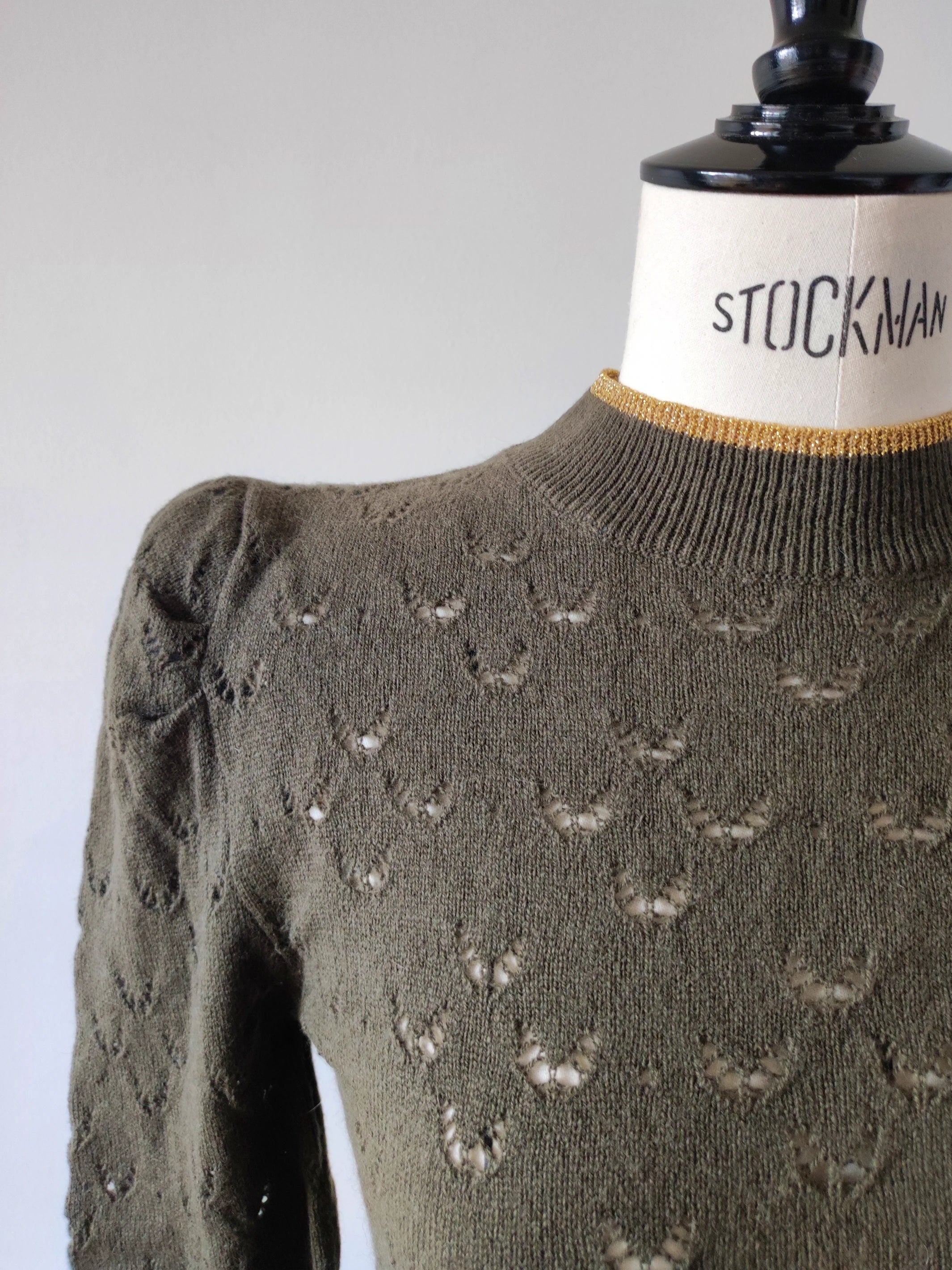 Openwork sweater with funnel collar and puff sleeves